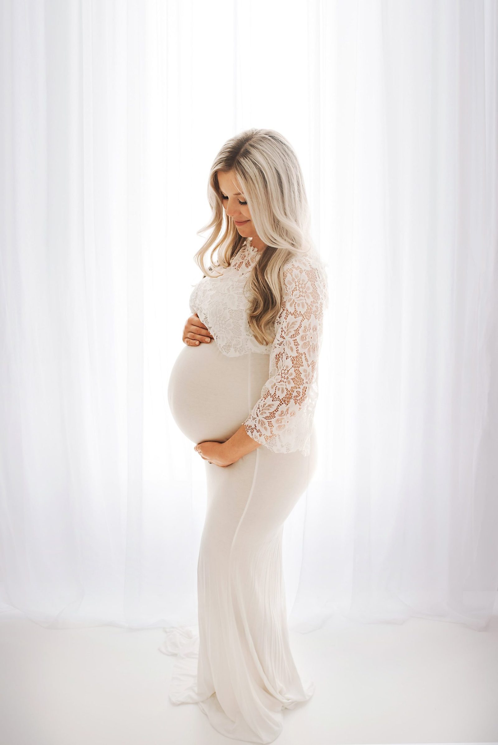 in-studio maternity photoshoot white dress