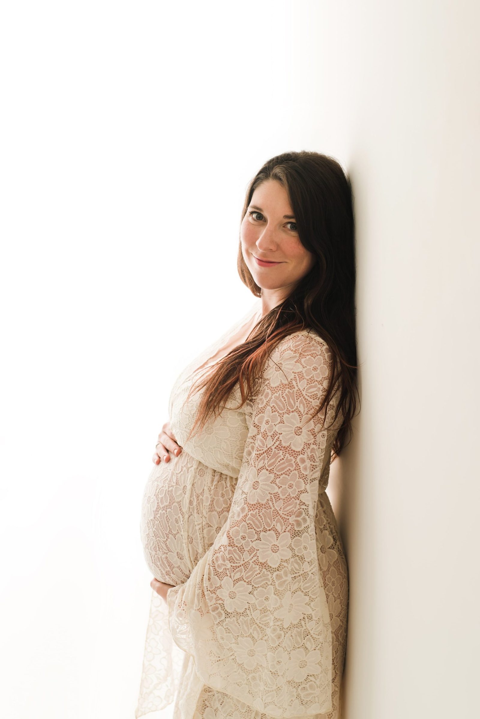 in-studio maternity photoshoot cream dress