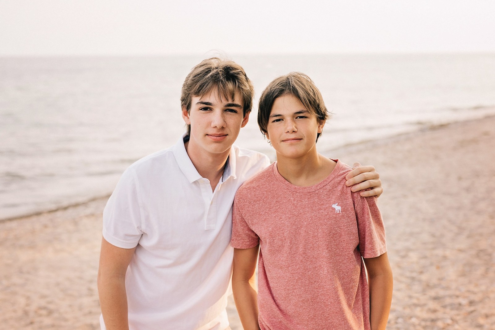 two teenage brothers on beach